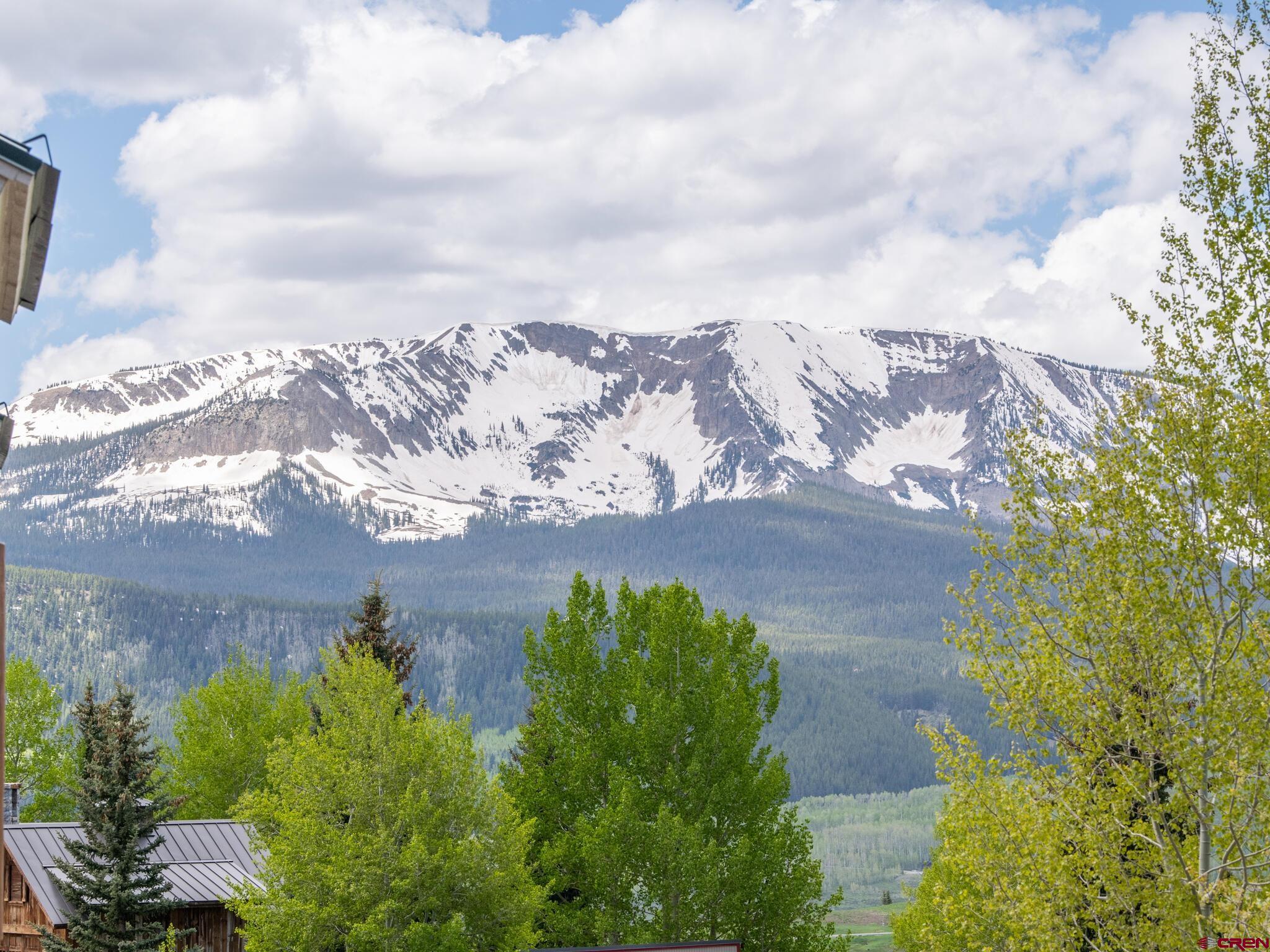 24 Hunter Hill Road, Unit 8 Crested Butte, CO 81225 - Photo 30 of 34 an aerial view of a house with a yard and mountain view in back
