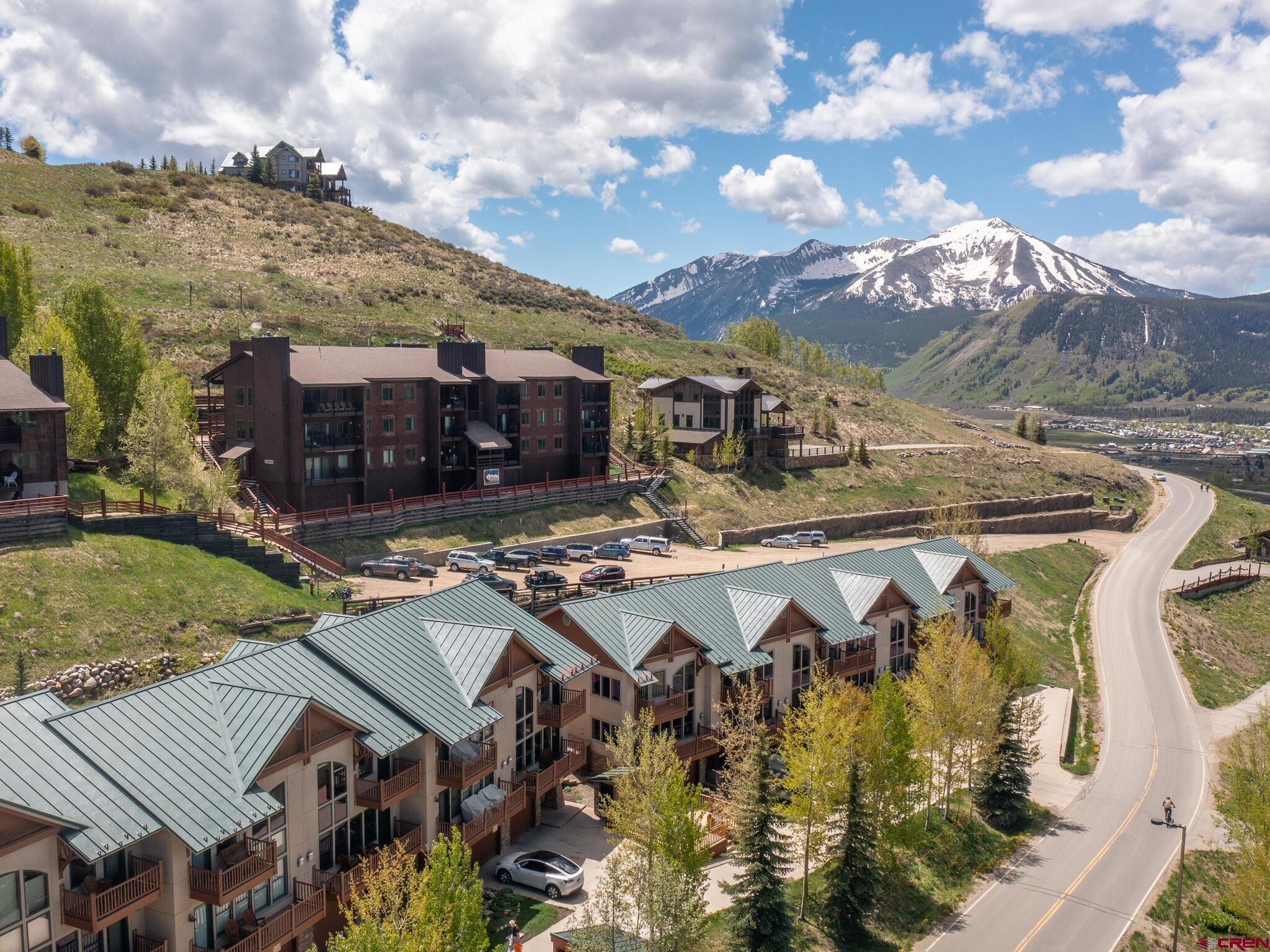 24 Hunter Hill Road, Unit 8 Crested Butte, CO 81225 - Photo 33 of 34 a view of a house with swimming pool and sitting area