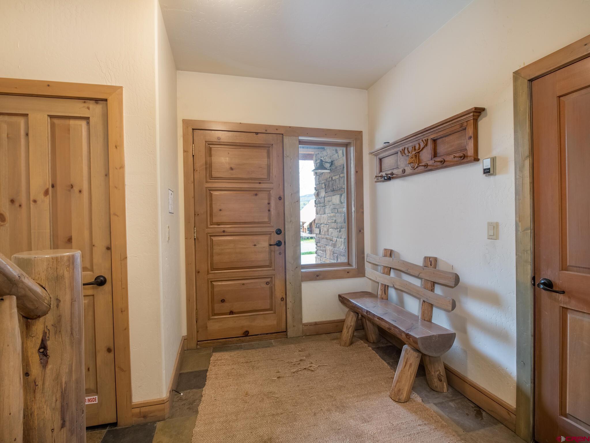 24 Hunter Hill Road, Unit 8 Crested Butte, CO 81225 - Photo 4 of 34 view of bedroom with furniture and windows