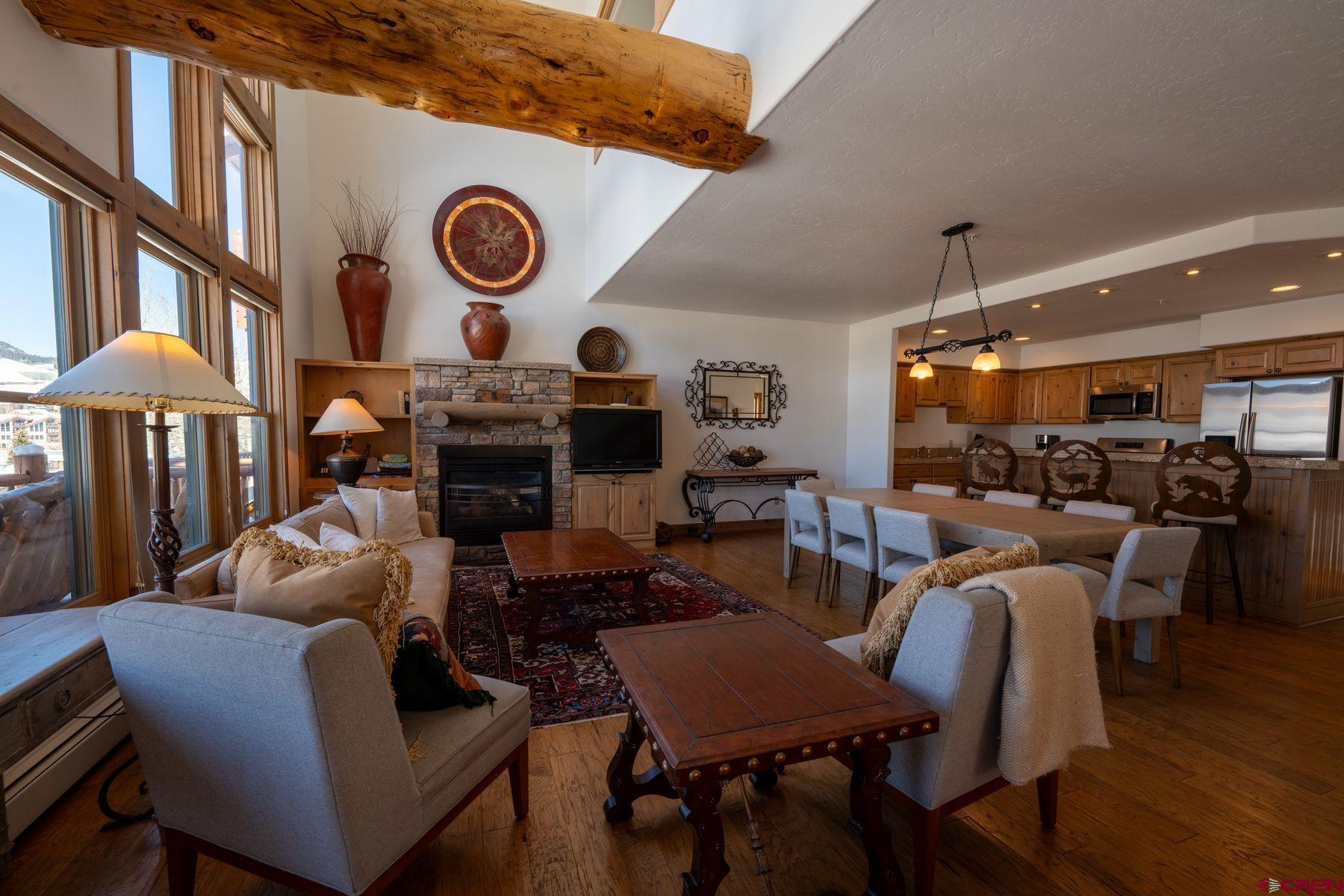 24 Hunter Hill Road, Unit 8 Crested Butte, CO 81225 - Photo 8 of 34 a living room with furniture and a large window