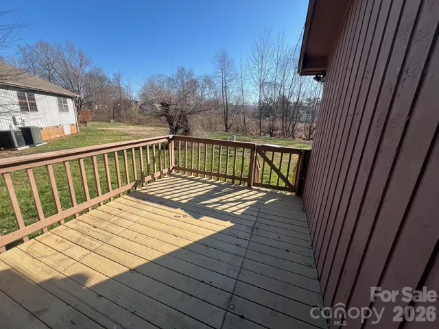 a view of balcony with wooden floor