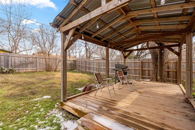 a bathroom with a sink a toilet and a window