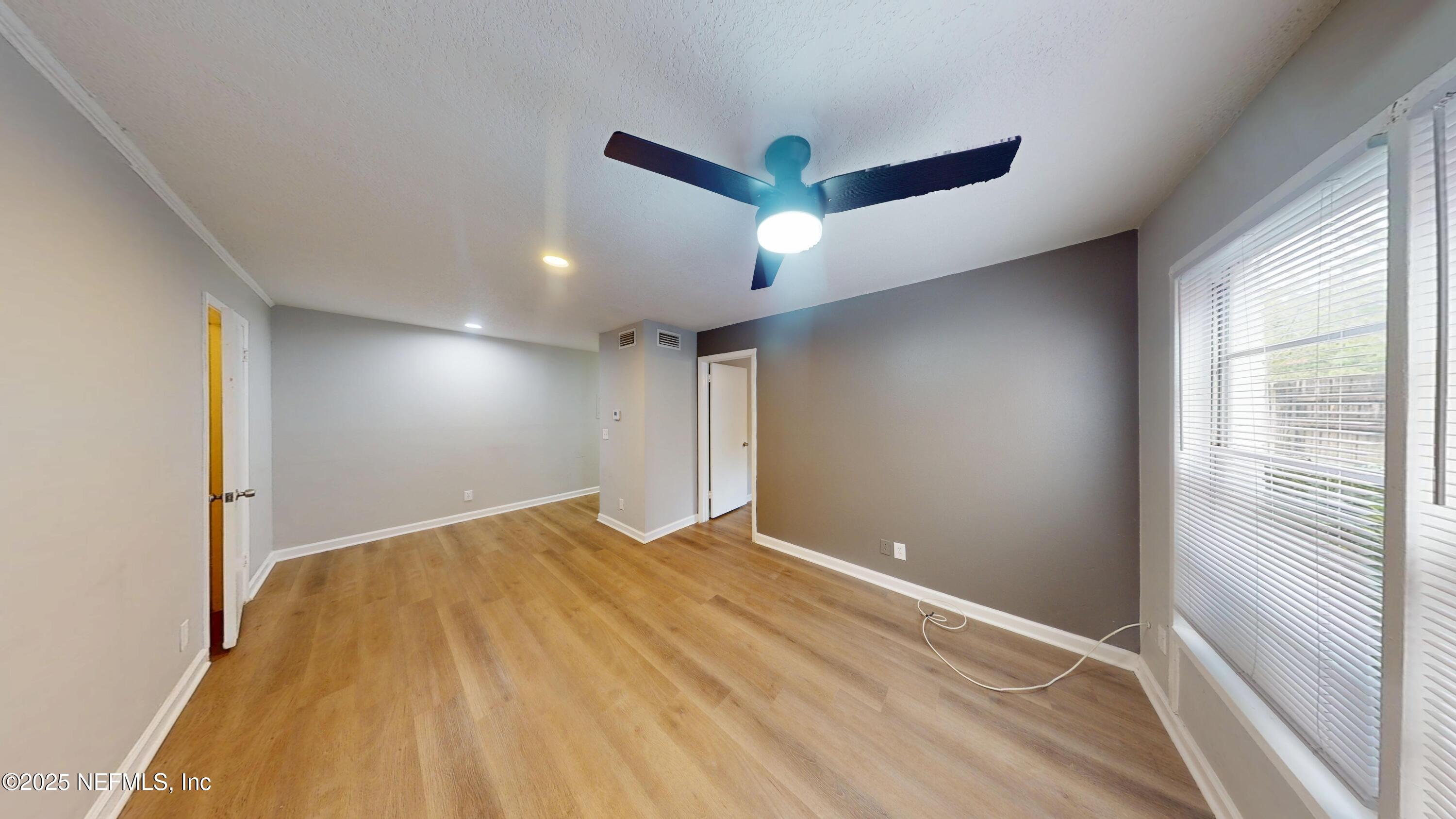 2887 Post Street, Unit 1 Jacksonville, FL 32205 - Photo 2 of 7 a view of empty room with wooden floor