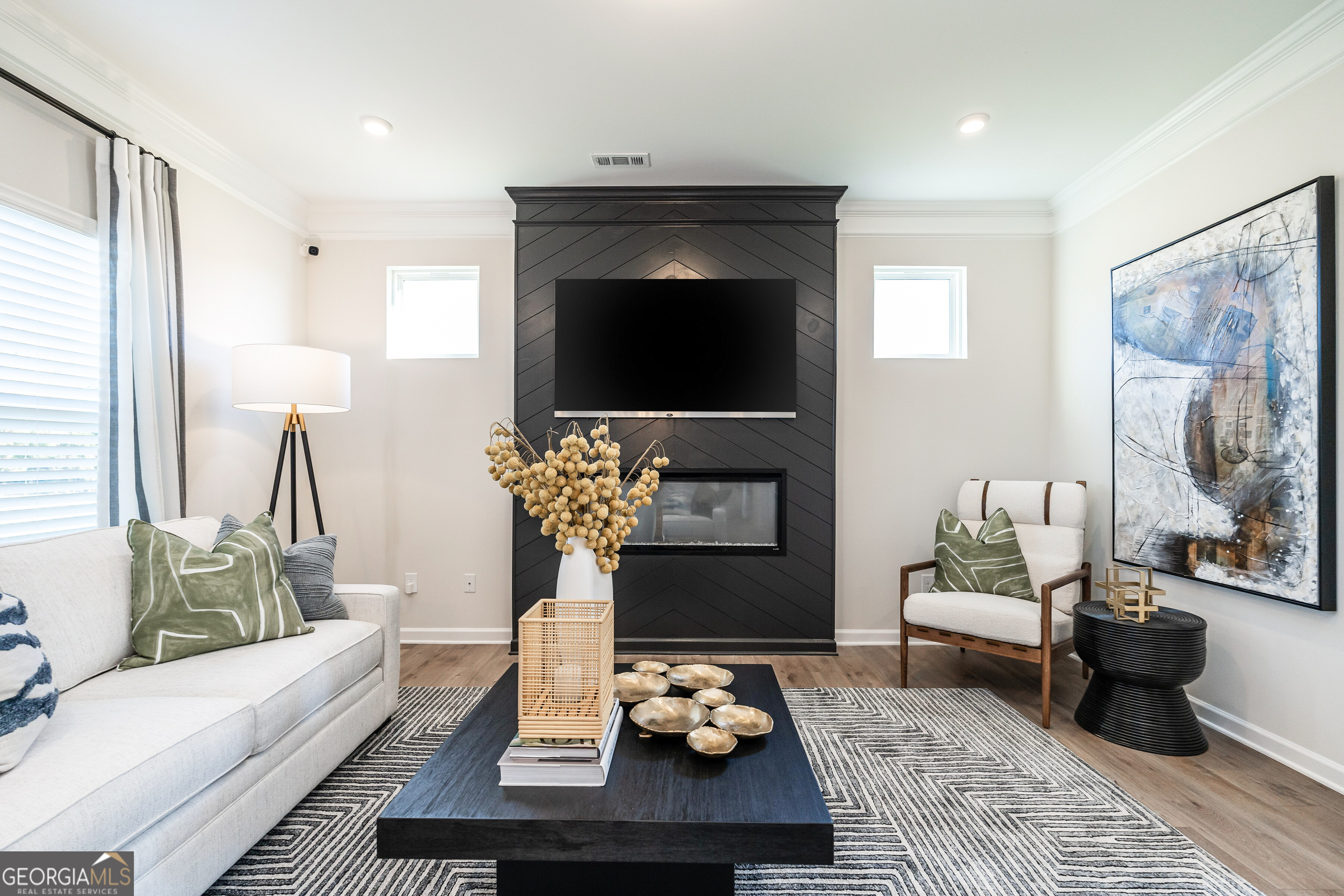 10410 Trellis Lane, Unit (LOT 35) Hampton, GA 30228 - Photo 11 of 28 a living room with furniture and a fireplace