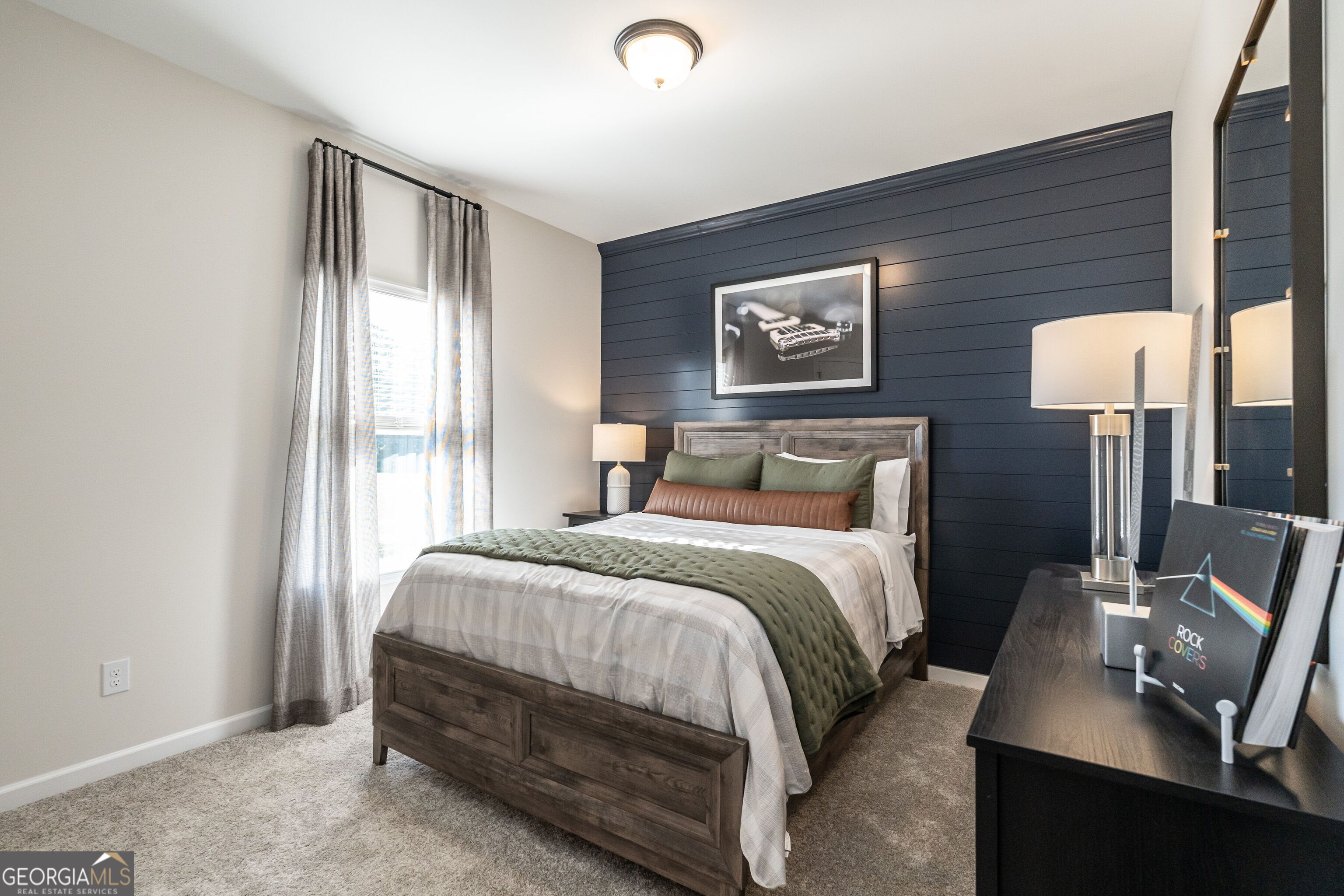 10410 Trellis Lane, Unit (LOT 35) Hampton, GA 30228 - Photo 27 of 28 a bedroom with a bed and a lamp next to a window