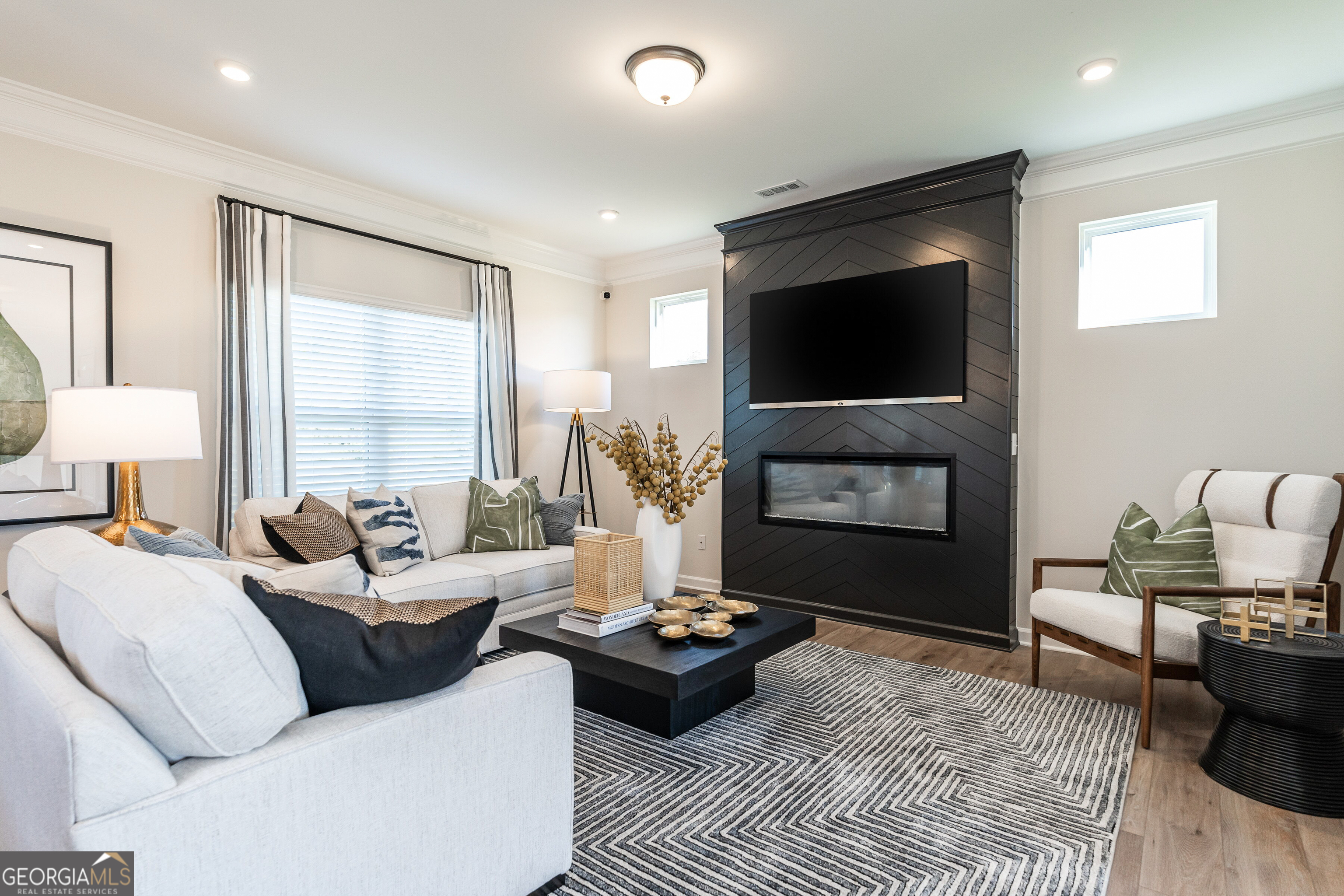 10410 Trellis Lane, Unit (LOT 35) Hampton, GA 30228 - Photo 10 of 28 a living room with furniture and a flat screen tv