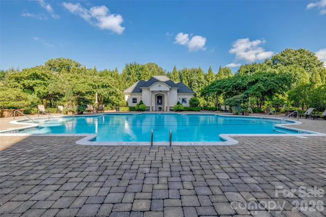 a view of a yard and front of a house