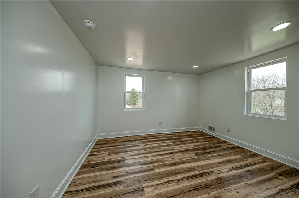 242 Dickens Street Latrobe, PA 15650 - Photo 14 of 25 a view of a room with wooden floor and window