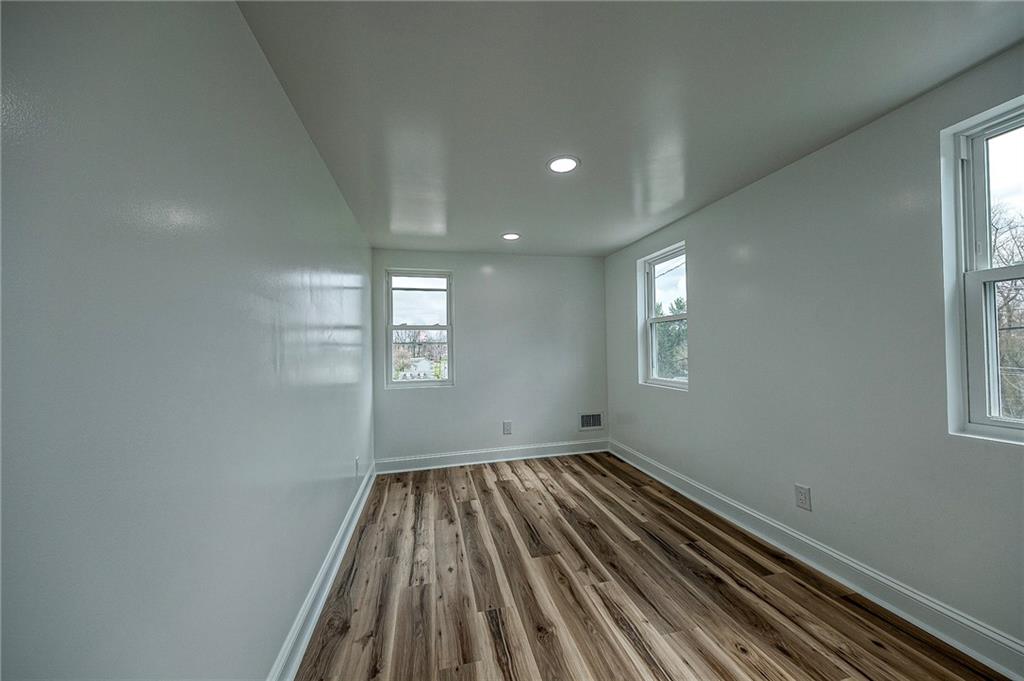 242 Dickens Street Latrobe, PA 15650 - Photo 16 of 25 a view of a room with wooden floor and window