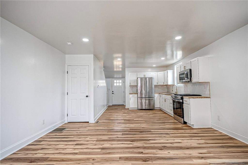 242 Dickens Street Latrobe, PA 15650 - Photo 5 of 25 a view of kitchen with wooden floor