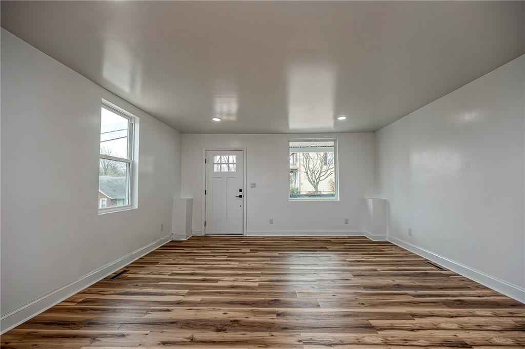 242 Dickens Street Latrobe, PA 15650 - Photo 7 of 25 a view of empty room with wooden floor and fan
