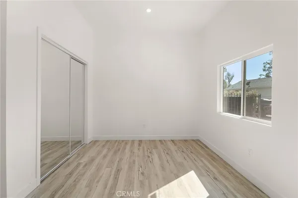 a bathroom with a sink toilet and a mirror