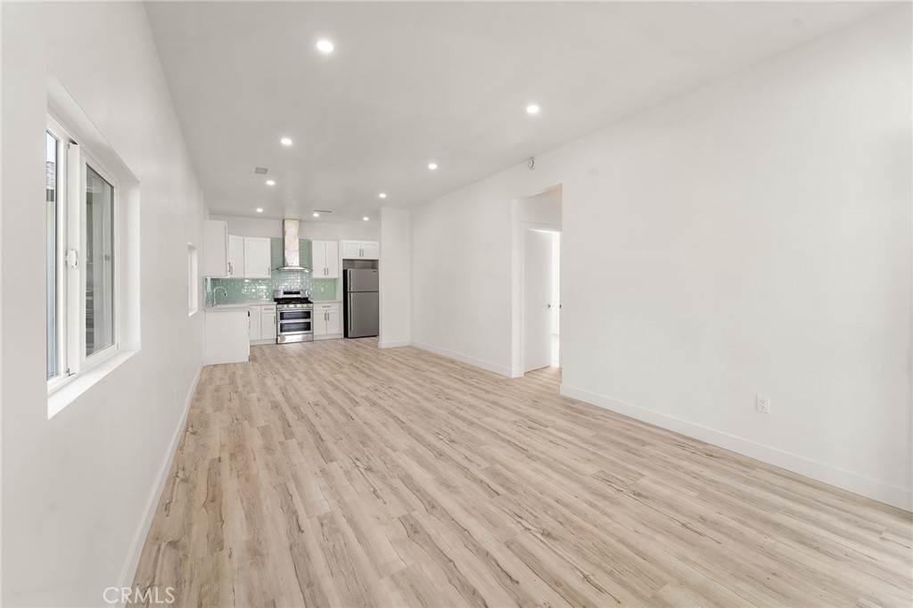 10730 Strathern Street Sun Valley, CA 91352 - Photo 2 of 57 a view of a kitchen with wooden floor and a window