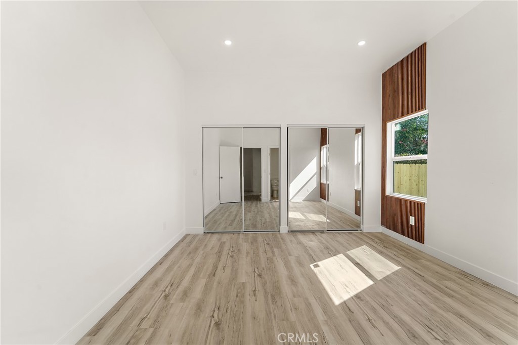 10730 Strathern Street Sun Valley, CA 91352 - Photo 21 of 57 a view of a room with wooden floor staircase and a hallway