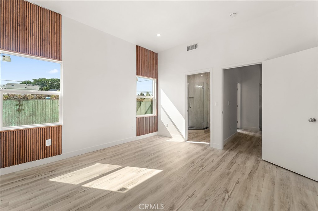 10730 Strathern Street Sun Valley, CA 91352 - Photo 23 of 57 an empty room with wooden floor and a window