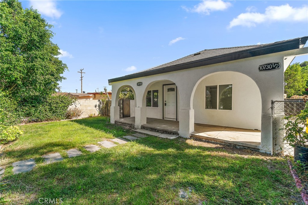 10730 Strathern Street Sun Valley, CA 91352 - Photo 28 of 57 a front view of a house with garden