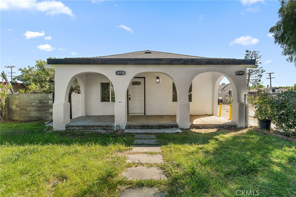 10730 Strathern Street Sun Valley, CA 91352 - Photo 29 of 57 a front view of a house with garden