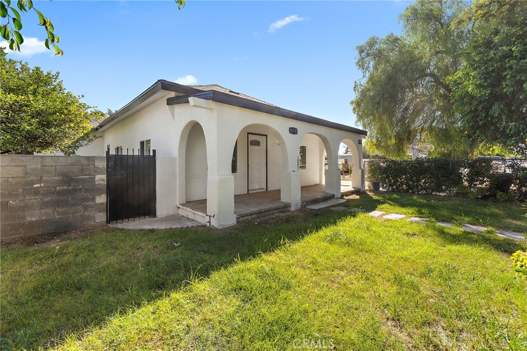 10730 Strathern Street Sun Valley, CA 91352 - Photo 30 of 57 a view of a house with a yard