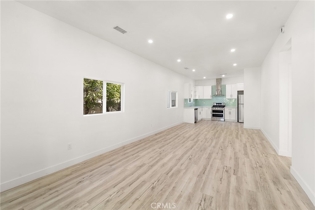 10730 Strathern Street Sun Valley, CA 91352 - Photo 3 of 57 a view of kitchen with stainless steel appliances a refrigerator and a microwave