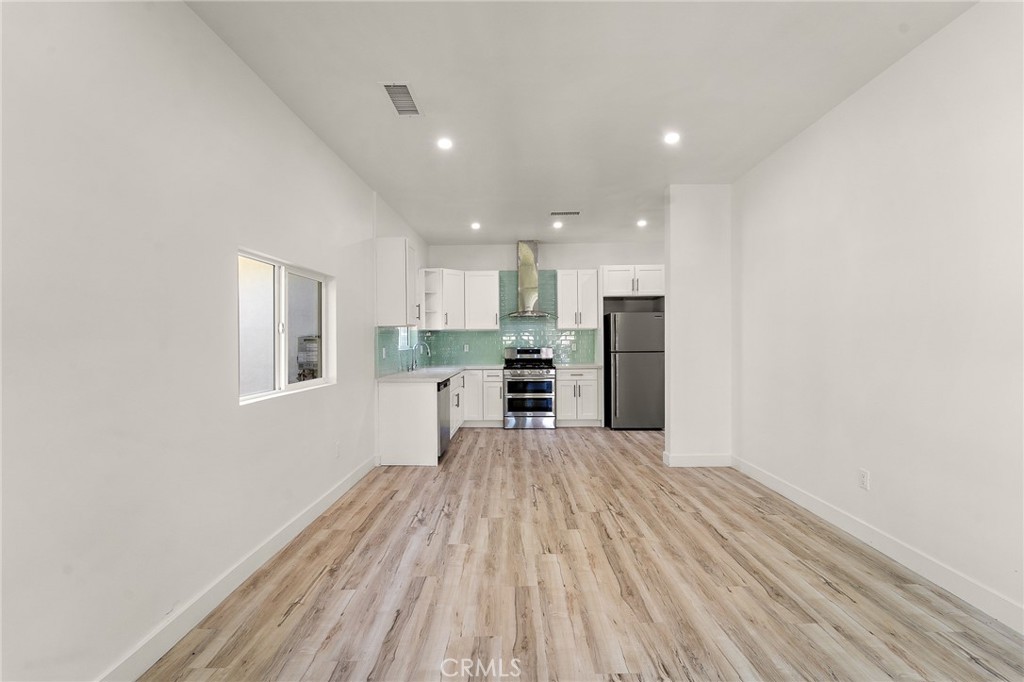 10730 Strathern Street Sun Valley, CA 91352 - Photo 5 of 57 a view of kitchen with wooden floor