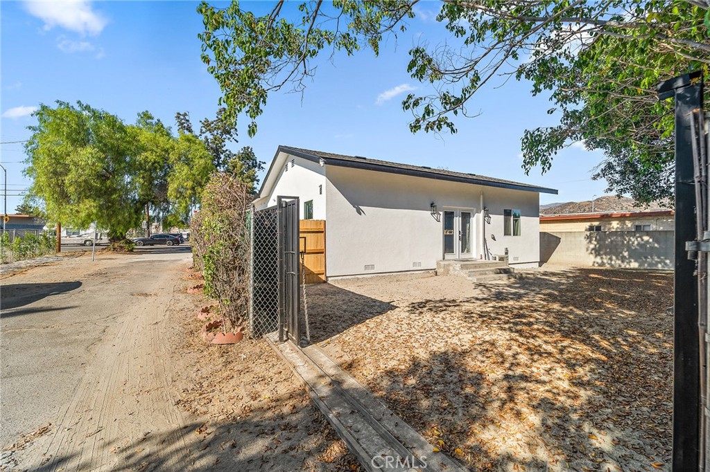 10730 Strathern Street Sun Valley, CA 91352 - Photo 55 of 57 a view of a house with a snow covered by side of a road
