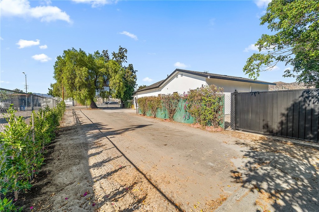 10730 Strathern Street Sun Valley, CA 91352 - Photo 56 of 57 a front view of a house with a yard and a garage