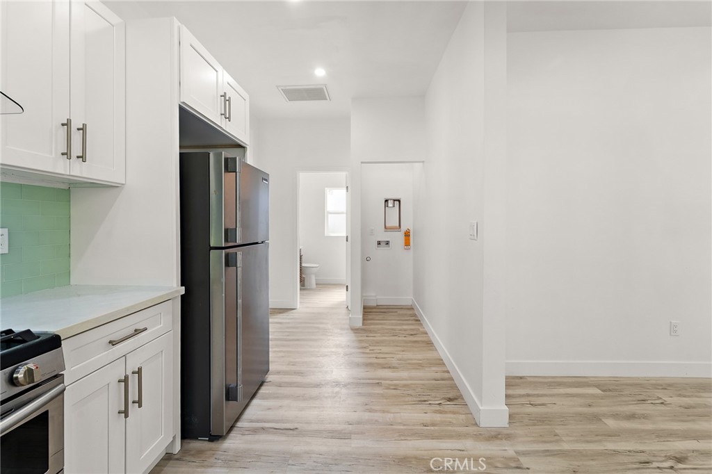 10730 Strathern Street Sun Valley, CA 91352 - Photo 10 of 57 a view of a kitchen from the hallway