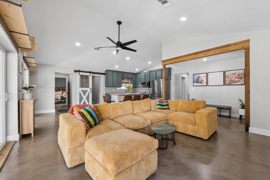 286 Benevolence Way China Spring, TX 76633 - Photo 7 of 37 Open-concept living space featuring wood-finish flooring, recessed lighting, and a modern ceiling fan