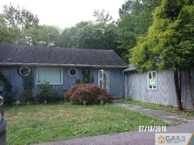 1747 Englishtown Road Old Bridge, NJ 08857 - Photo 1 of 1 a front view of a house with garden
