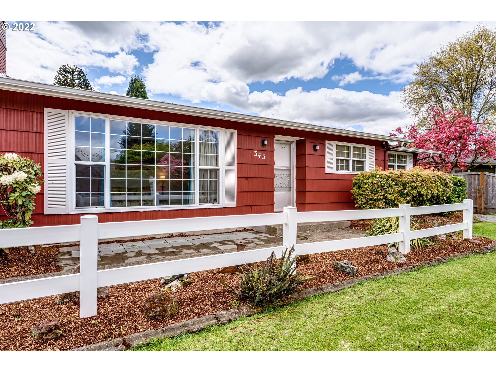 345 Mansfield Street Springfield, OR 97477 - Photo 1 of 31 a front view of a house with a yard