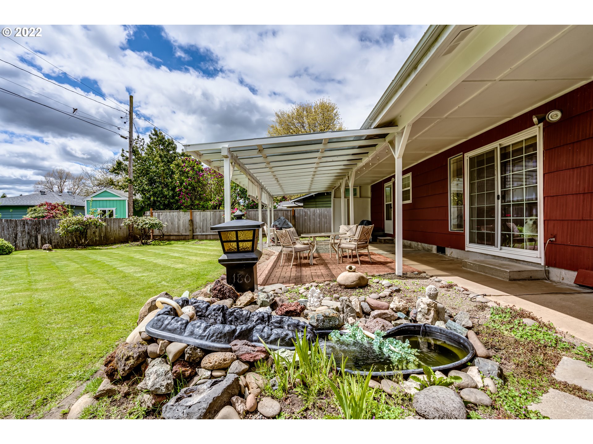 345 Mansfield Street Springfield, OR 97477 - Photo 27 of 31 a front view of house with yard and outdoor seating