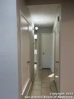 a bathroom with a shower and a glass door