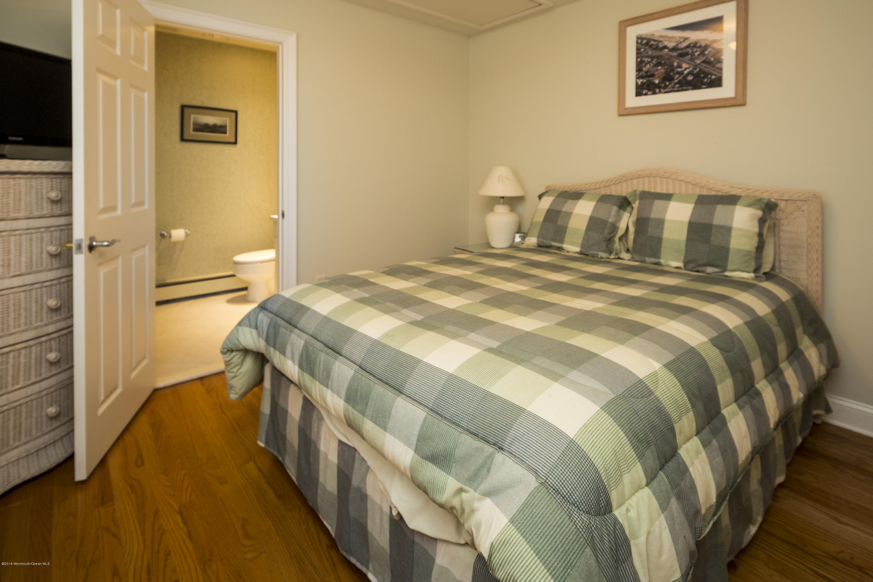 41 White Street Long Branch, NJ 07740 - Photo 15 of 29 a bedroom with a bed and a flat screen tv