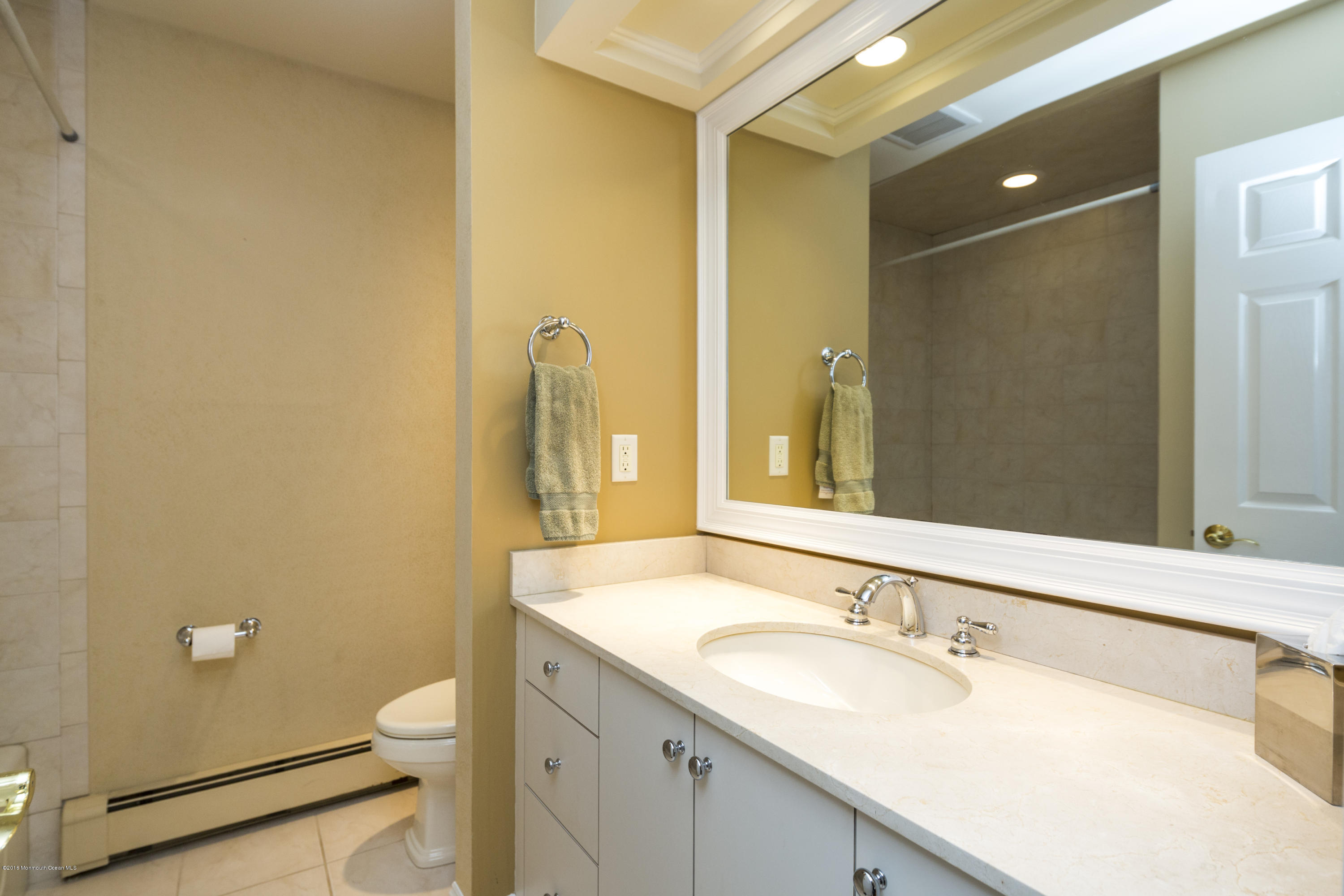 41 White Street Long Branch, NJ 07740 - Photo 18 of 29 a bathroom with a granite countertop sink mirror vanity and toilet