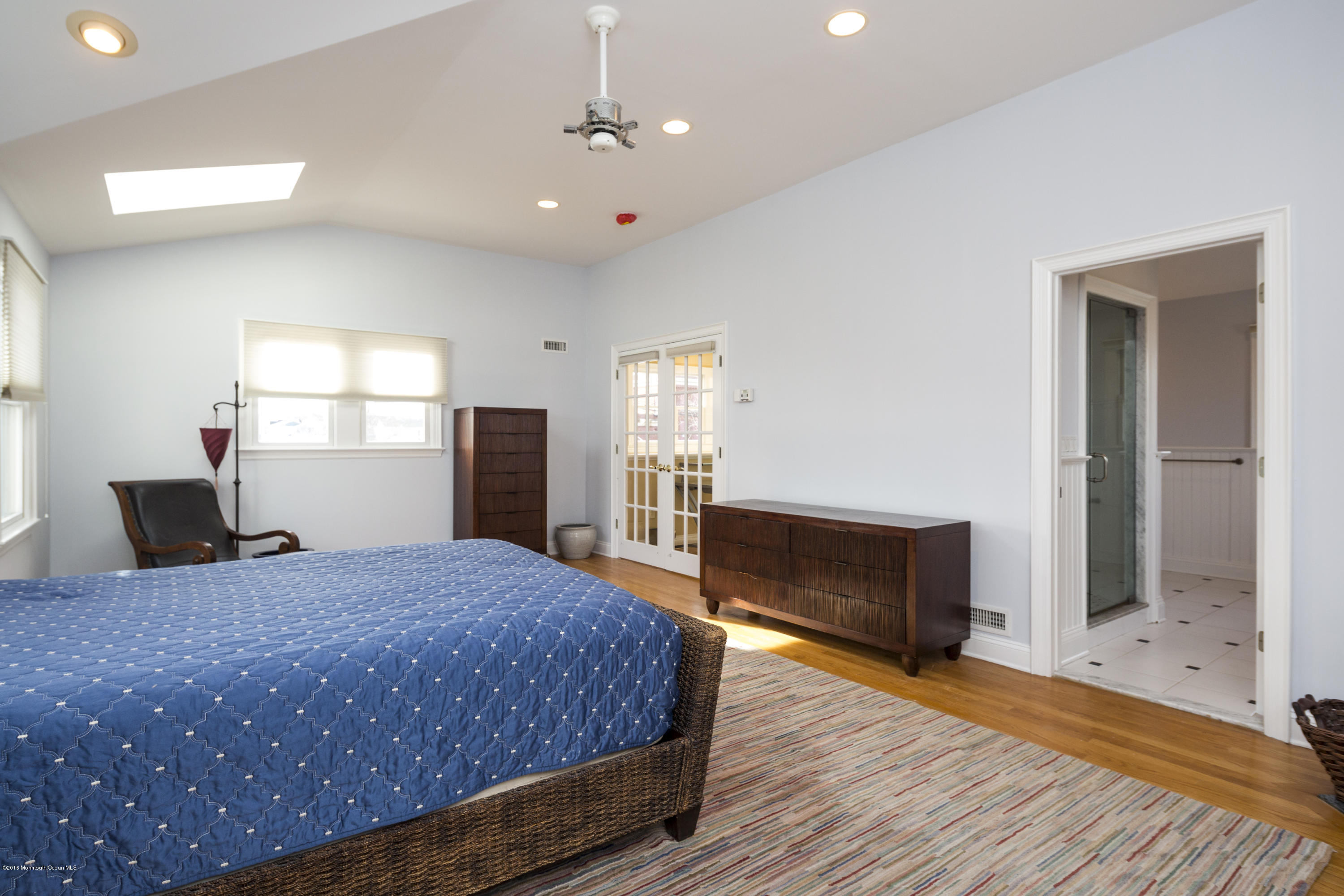 41 White Street Long Branch, NJ 07740 - Photo 20 of 29 a bedroom with a bed and a flat screen tv