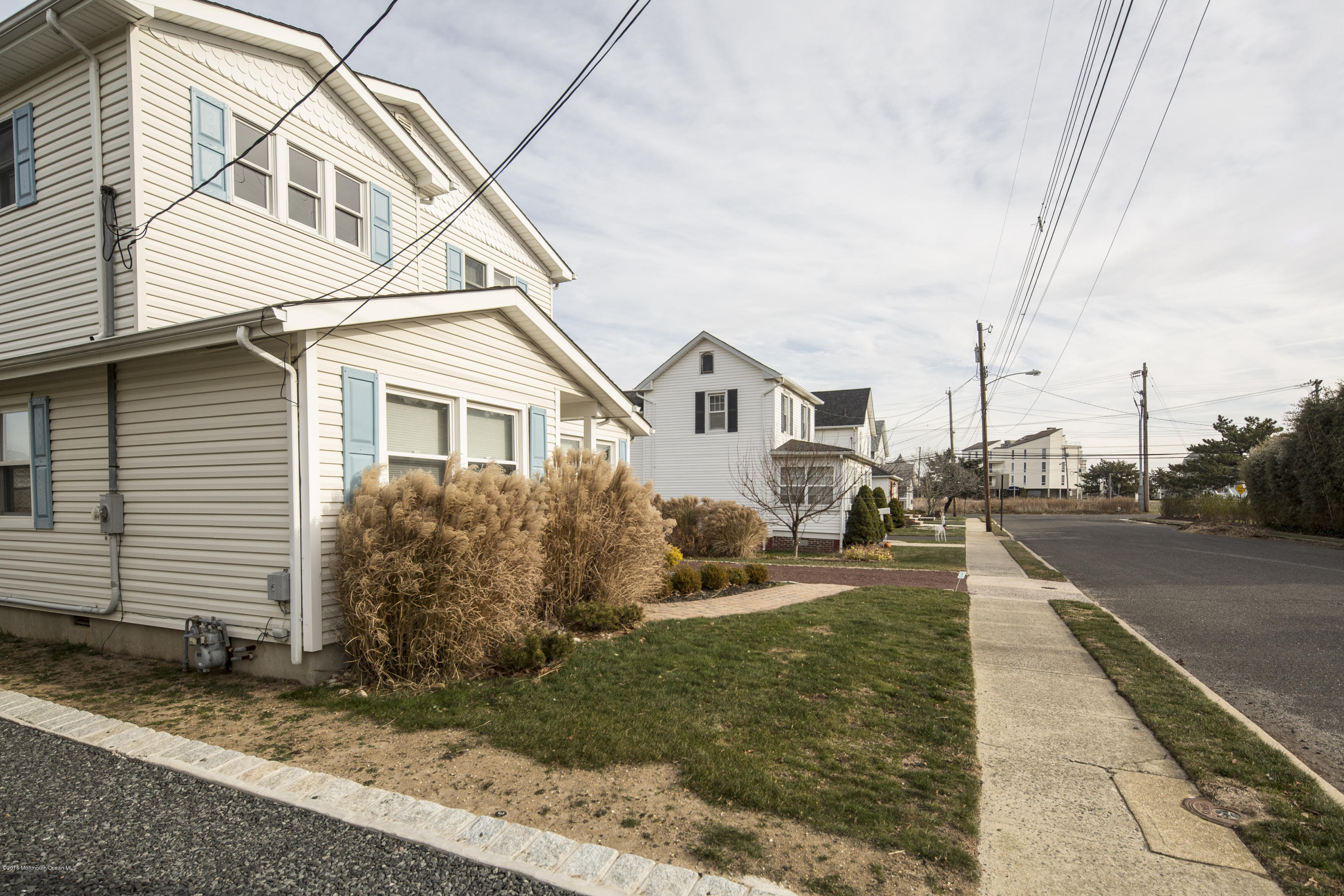 41 White Street Long Branch, NJ 07740 - Photo 28 of 29 a view of a white house next to a yard