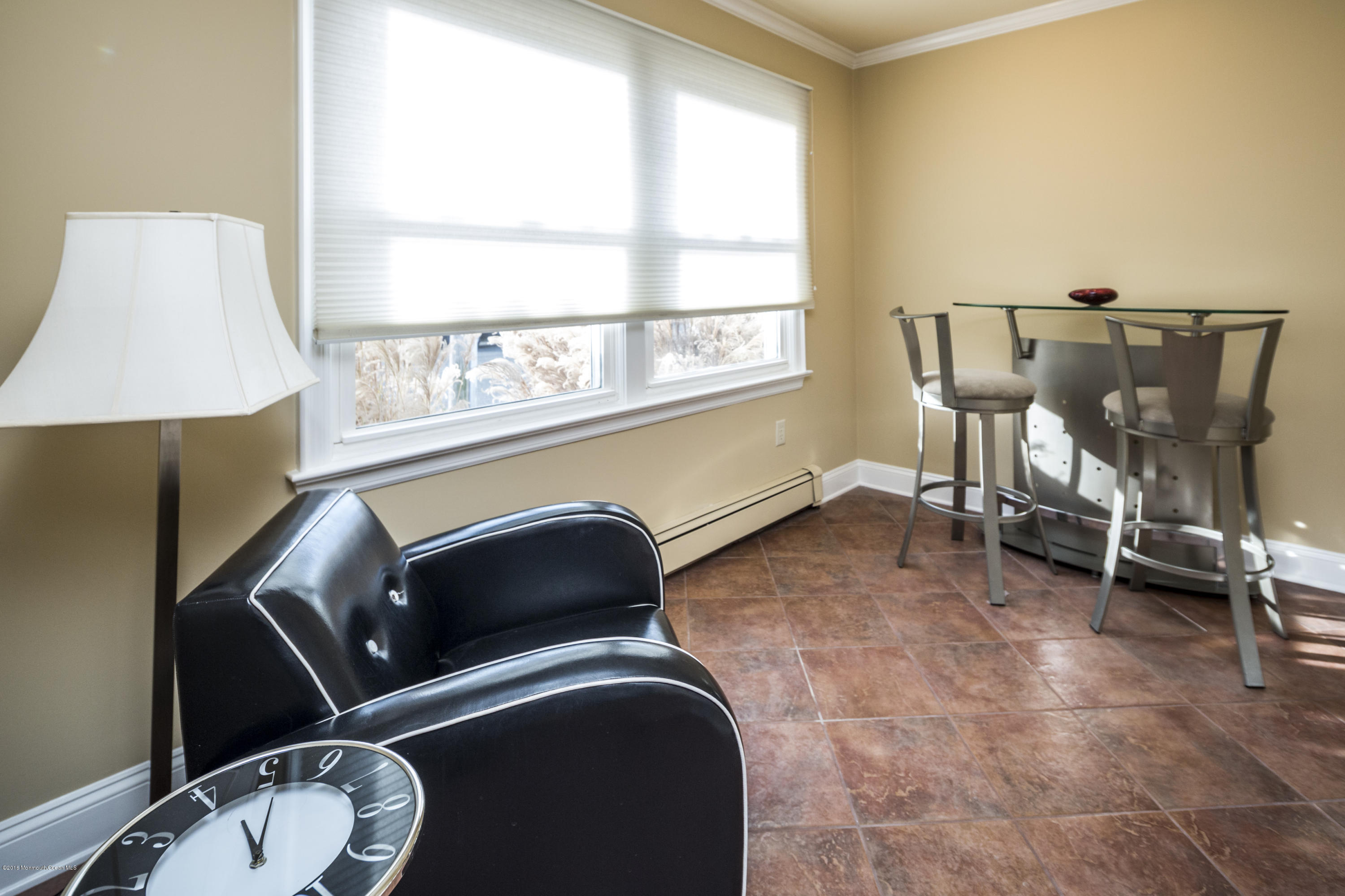 41 White Street Long Branch, NJ 07740 - Photo 7 of 29 a room with gym equipment and a large window