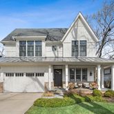 a front view of a house with garden and porch