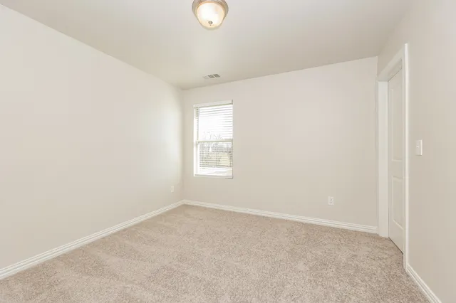 a view of a room that has a window in it