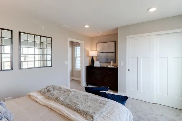 a bedroom with a bed and a television
