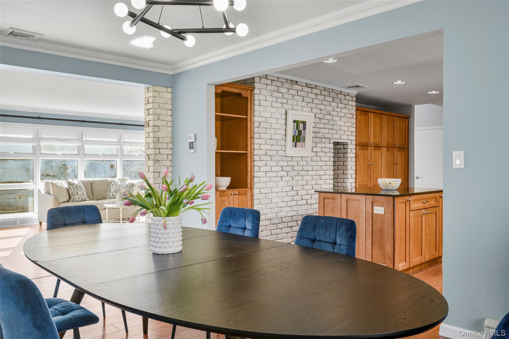 60 Overhill Road New Rochelle, NY 10804 - Photo 16 of 50 a dining room with furniture and potted plants