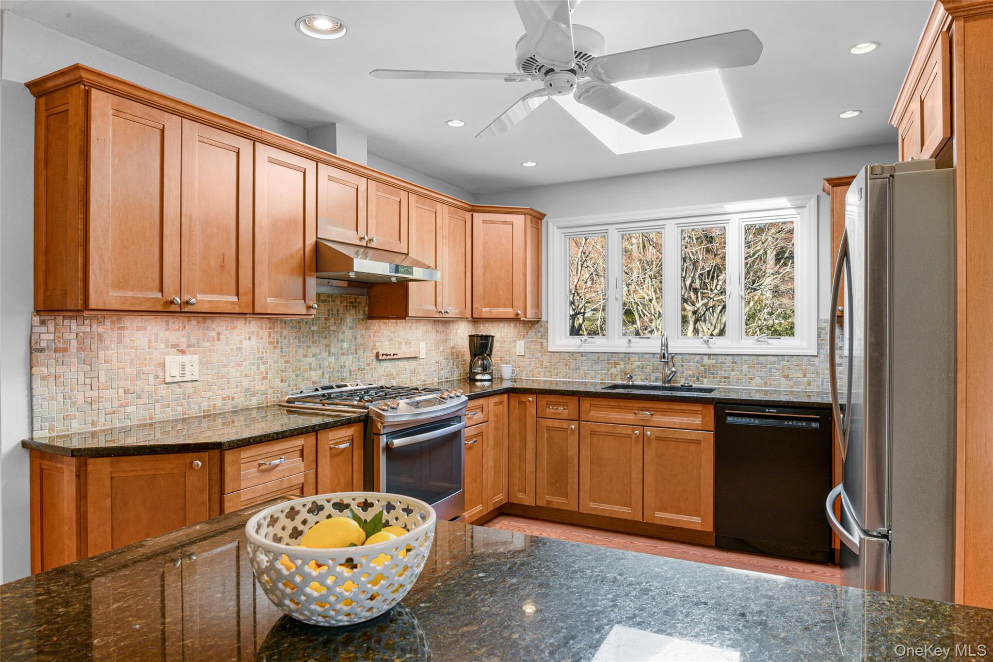 60 Overhill Road New Rochelle, NY 10804 - Photo 22 of 50 a kitchen with granite countertop a stove sink and microwave