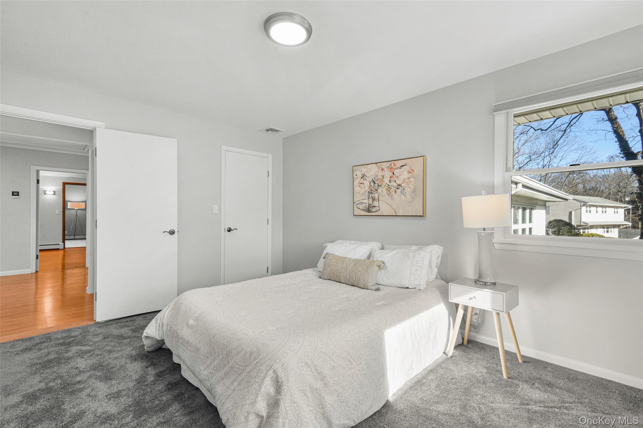 60 Overhill Road New Rochelle, NY 10804 - Photo 27 of 50 a bedroom with a bed and a large window