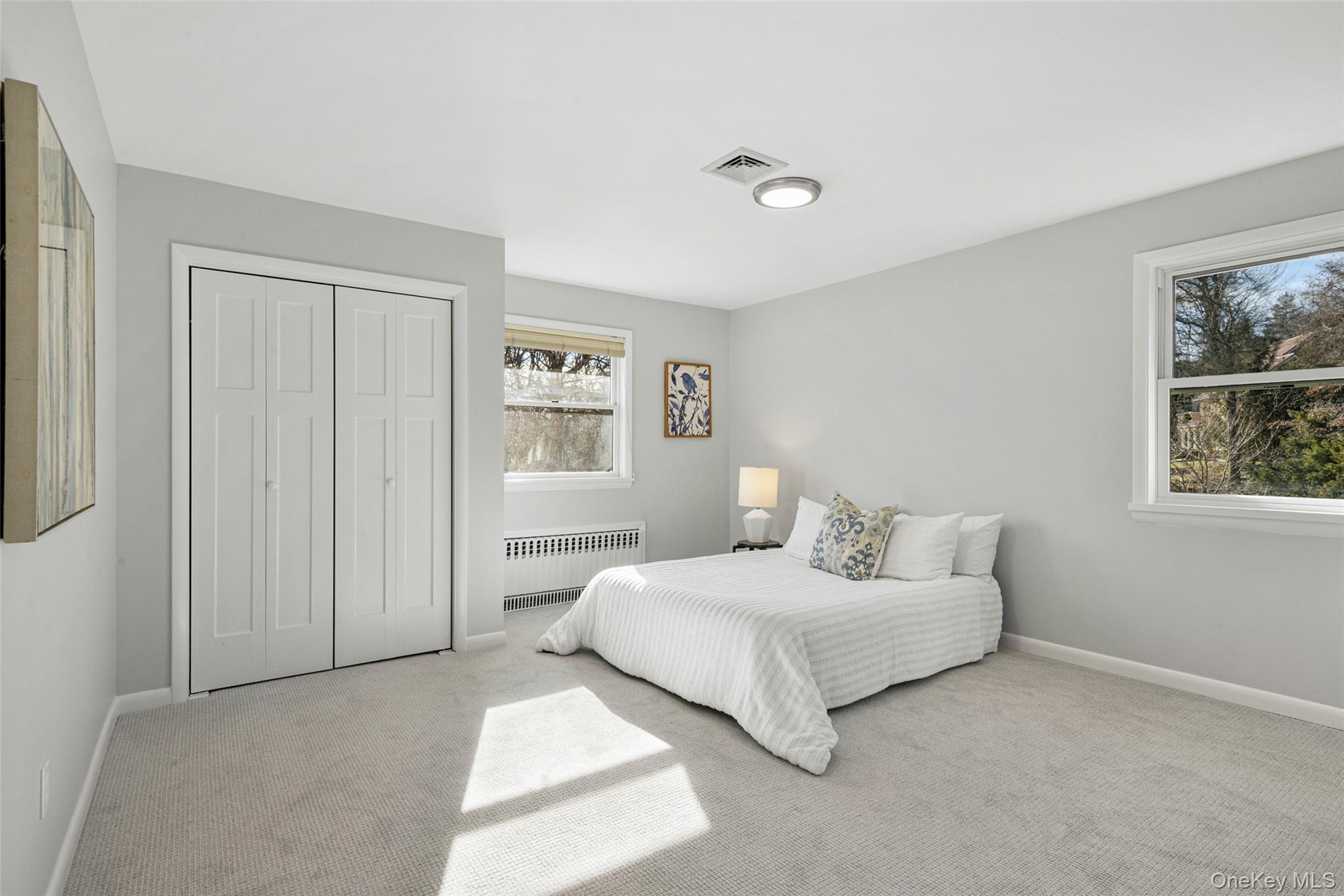 60 Overhill Road New Rochelle, NY 10804 - Photo 28 of 50 a bedroom with a bed and a window