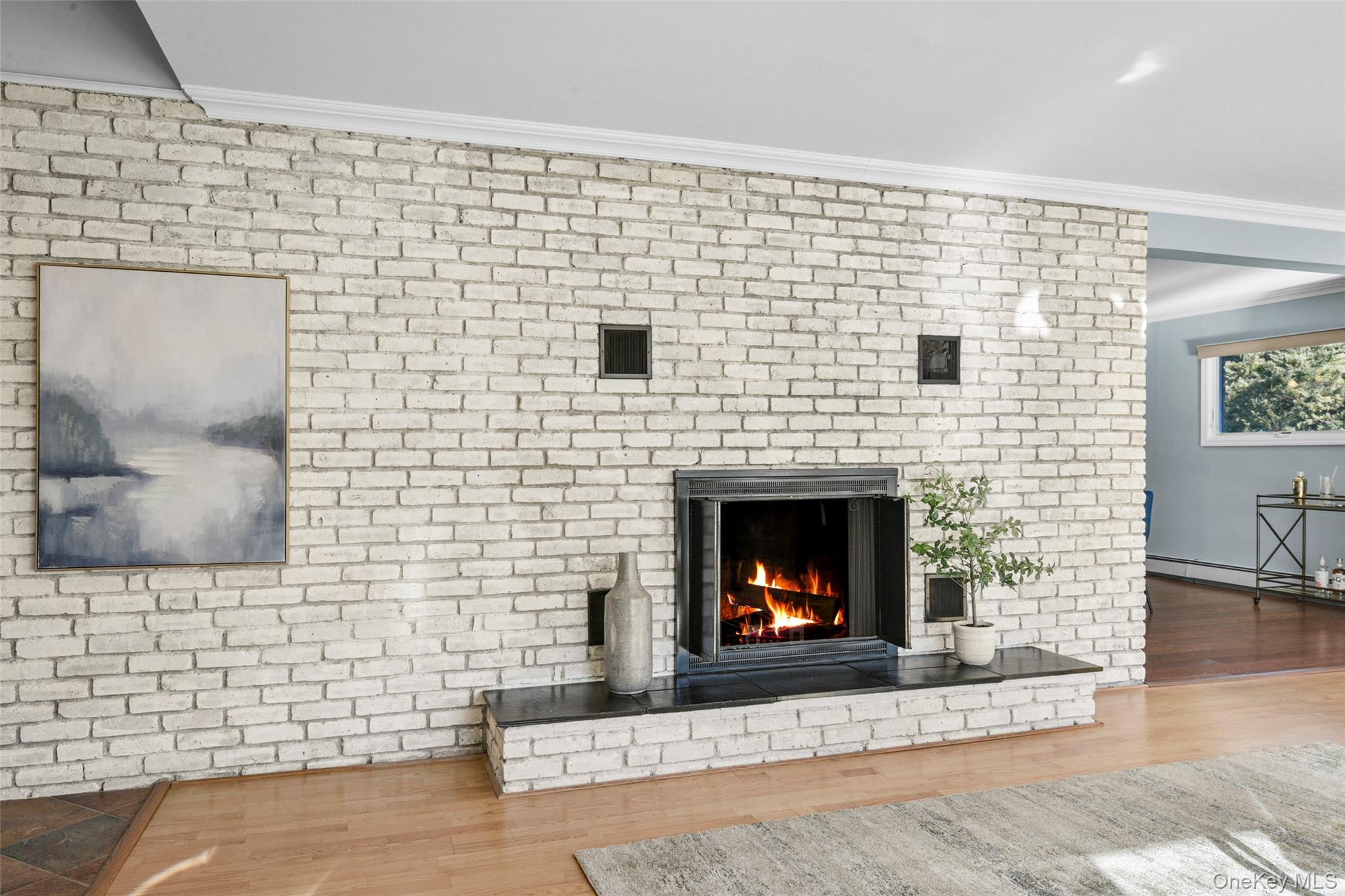 60 Overhill Road New Rochelle, NY 10804 - Photo 10 of 50 a brick oven with fireplace a fire place and a wooden floor