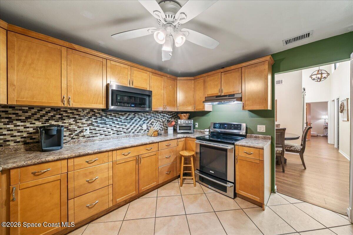 635 Jubilee Street Melbourne, FL 32940 - Photo 12 of 22 Updated wood cabinets