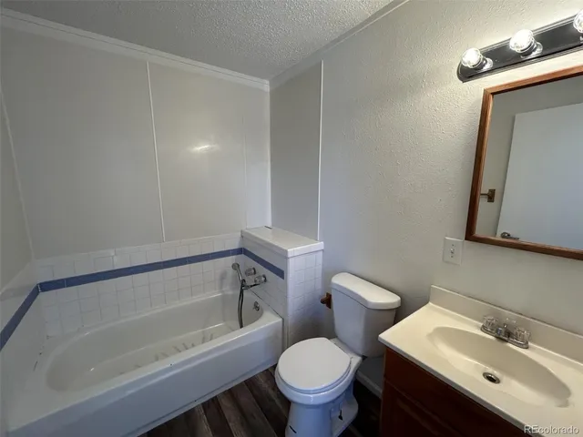 a bathroom with a sink toilet and bathtub