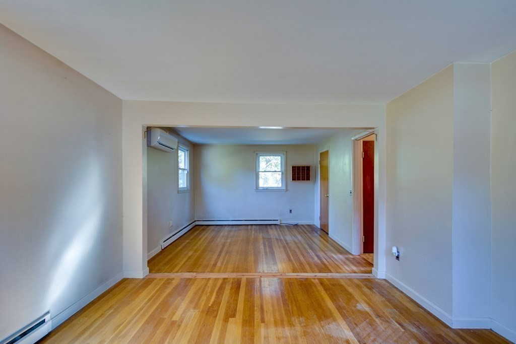 23 Fairmeadow Road Wilmington, MA 01887 - Photo 12 of 24 a view of a bedroom with wooden floor and closet