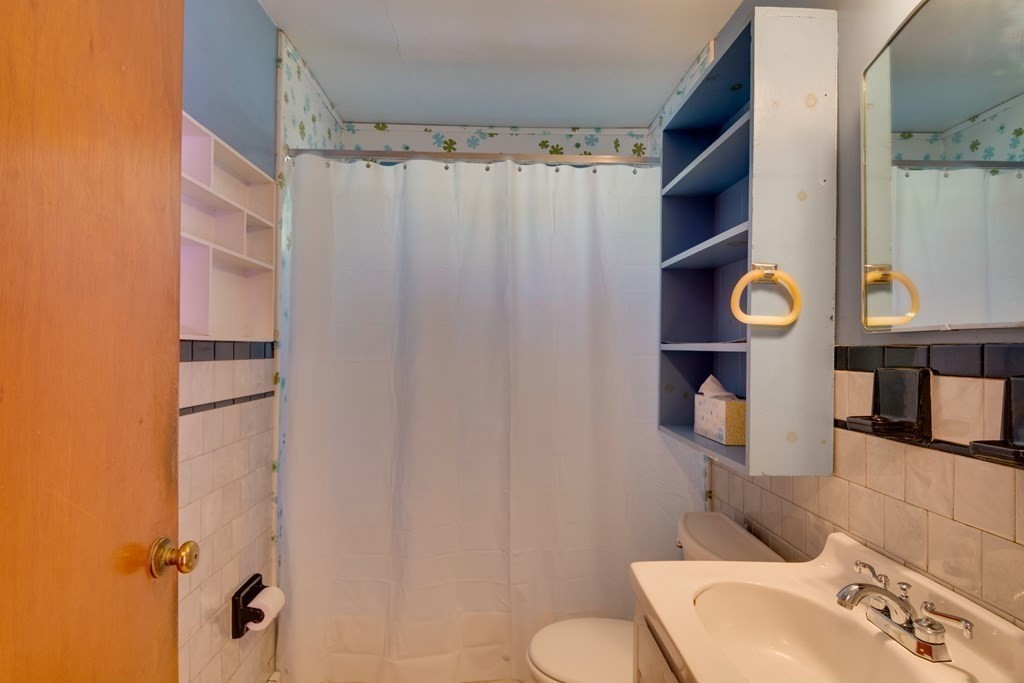 23 Fairmeadow Road Wilmington, MA 01887 - Photo 13 of 24 a bathroom with a sink toilet and shower