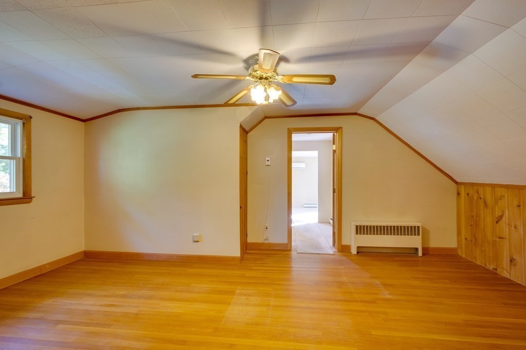 23 Fairmeadow Road Wilmington, MA 01887 - Photo 16 of 24 a view of a room with a chandelier and wooden floor